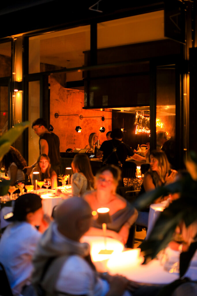 Guests gathered at candlelit tables in the restaurant's warmly lit dining room.